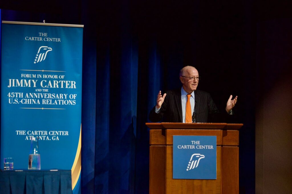 Stephen Orlins speaks from a podium at the Carter Center